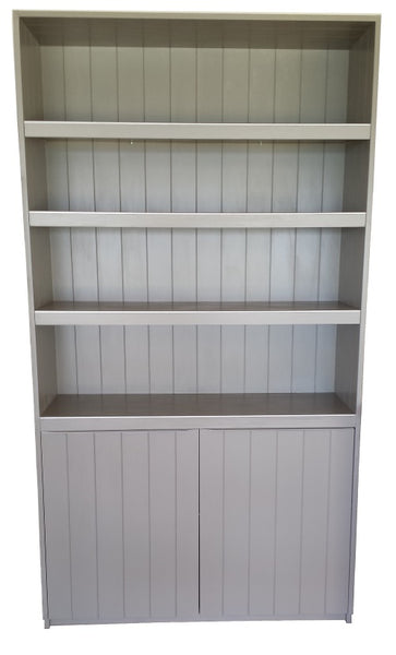 A cutout photo of a Plankwall Tall Display Cabinet painted grey with three  shelves and two drawers