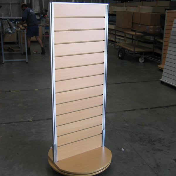 Plankwall two-sided retail display stand nonrotating in a wood finish on the factory floor