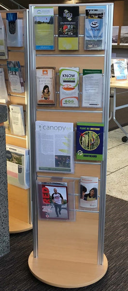 Plankwall Two-sided display stand in Tawa wood grain 495W merchandised with pamphlets