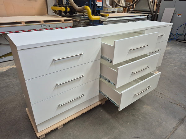 Plankwall white drawer cabinet unit center drawers open in a factory setting