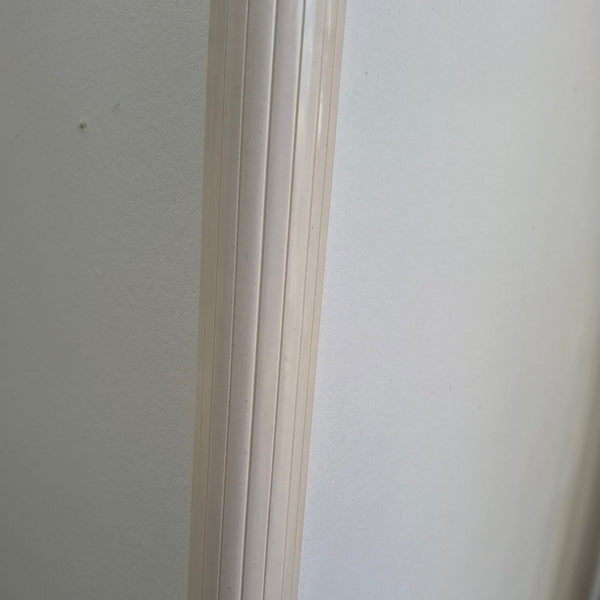 Close up of a RA18 PVC panel corner join profile in Cream joining two MDF panels
