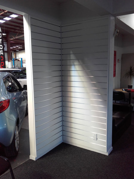 RA18 aluminium joinery profile non mitred used for an internal corner join for slatwall panels in a reception room