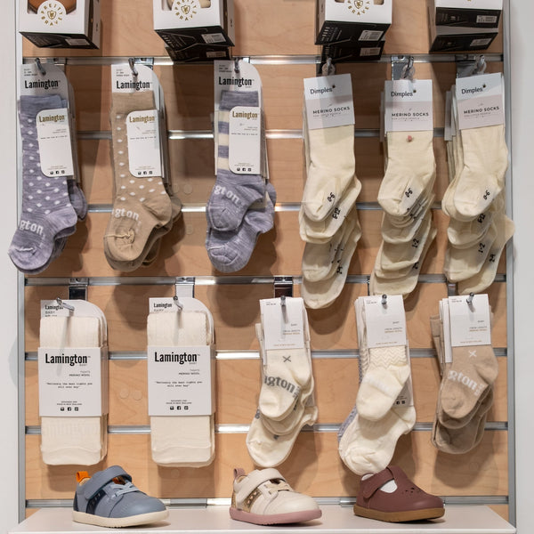 Display of Lamington socks on a wooden slatwall panel using chrome single prongs