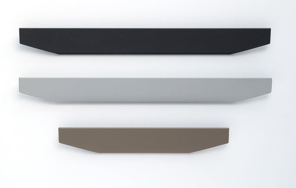 Three modern, angular DRAWPULL cabinet handles in black, light gray, and taupe are displayed vertically against a clean white background.