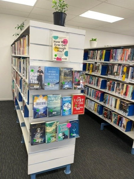 Whangamata library bay end display with featured books