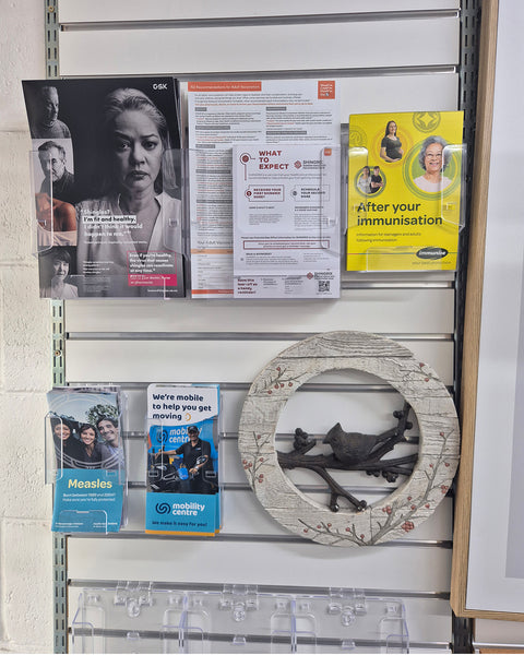 An assortment of clear acrylic brochure holders from A3-A5 mounted on Plankwall slatwall display system holding valuable medical information