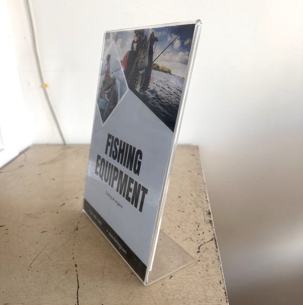 clear acrylic sign holder used in retail setting