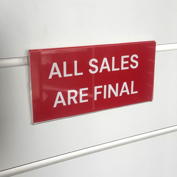 Red sign with 'All Sales Are Final' text on a white surface