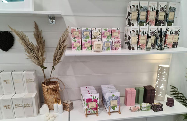 Gift shop display wall fitted with 18mm white melamine retail shelving