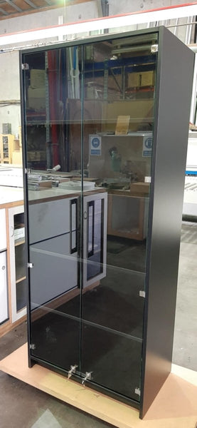 side view of a custom black display cabinet with glass doors