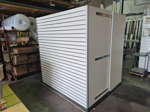 bespoke design and manufacture of a pharmacy consulting room showing front slatwall display space