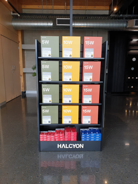 Black custom retail display stand with Halcyon products