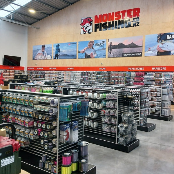 Plankwall shop fitout using Plankwall Double Plinth G60 Gondolas in black and black 50mm slatwall wall panels shown stocked with merchandise in the Monster Fishing retail showroom