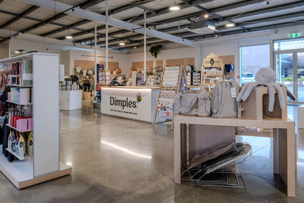 Store interior with 'Dimples' branding and product display.