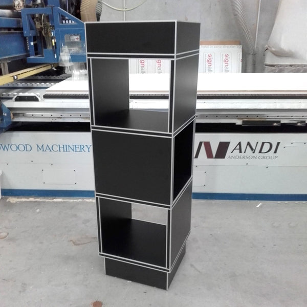 black open four sided display stand at the warehouse