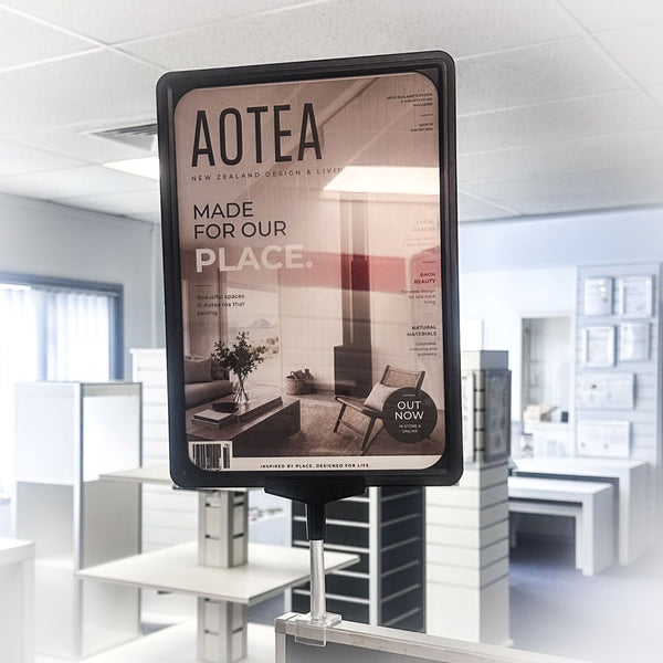Advertisement for Aotea magazine in a modern office setting
