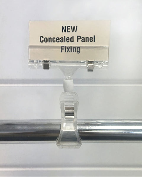Plankwall card clip with rotating head attached to a garment rail for retail price signage shown here