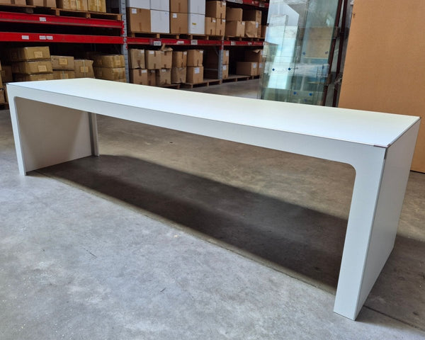 Large Plankwall Retail display table in white in a factory setting