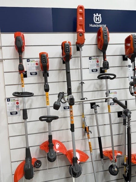 power tools supported by power tool display bracket on slatwall 