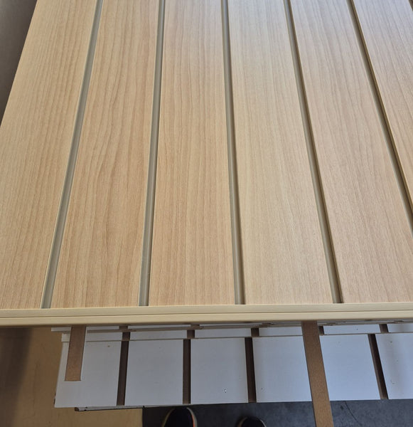 close-up of the slatwall panel pvc insert in tawa colour 