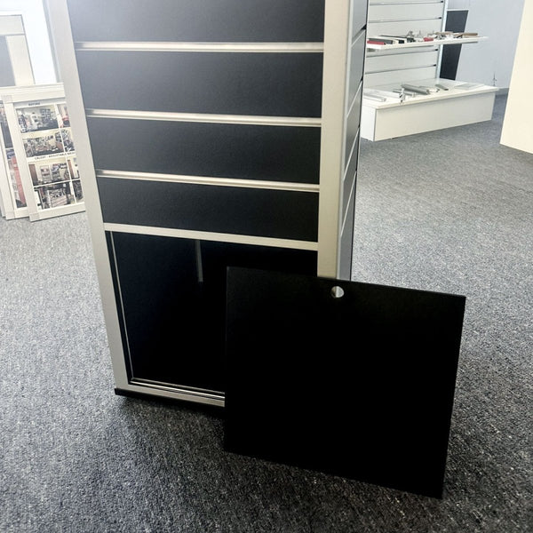 Store excess goods in rotating box tower display stand with built in hidden storage at the bottom