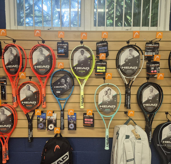 retail slatwall panel with pvc inserts in tawa displaying tennis racquets