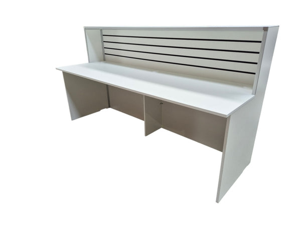 Custom reception desk and welcome counter with slatwall panelling and MDF fabrication, manufactured in Plankwall’s Auckland factory