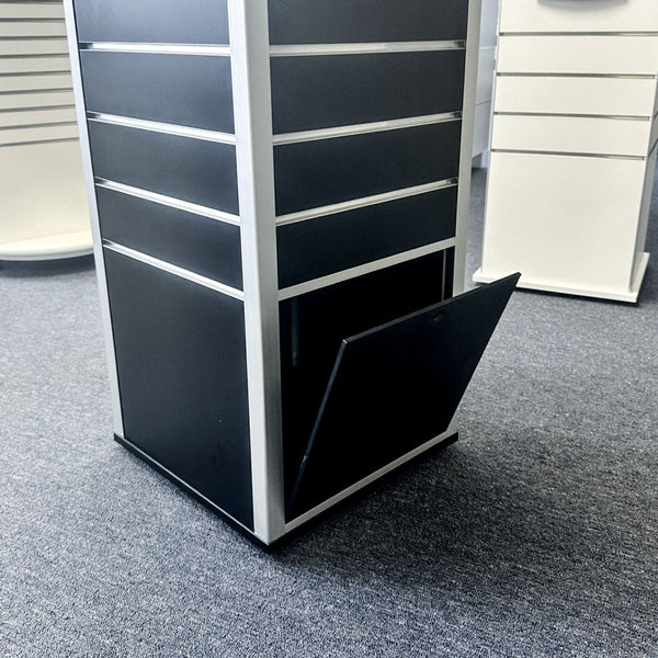 Rotating box tower display stand with built in hidden storage at the bottom