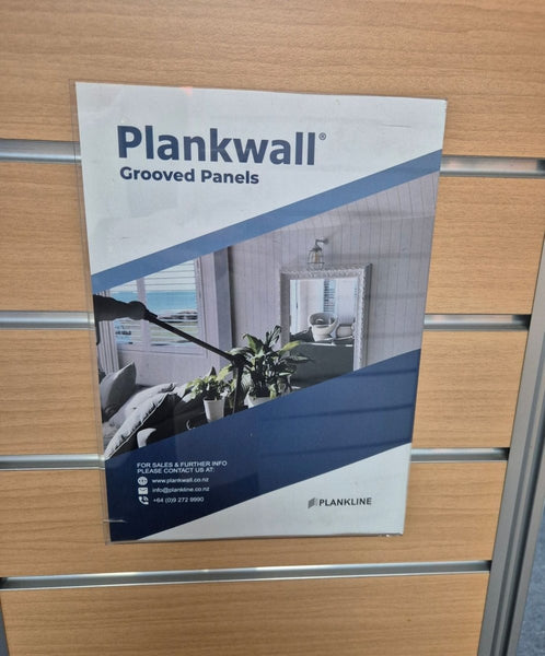 Plankwall grooved panels leaflet displayed in a brochure holder mounted on a slatwall panel  