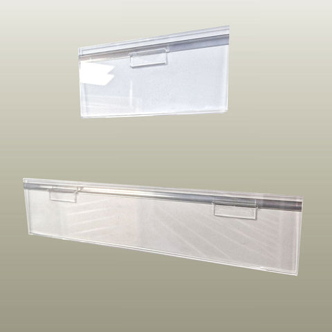 Clear acrylic slatwall header card sign holder with pre-glued PC2 hooks mounted on slatwall panel displaying product header information.