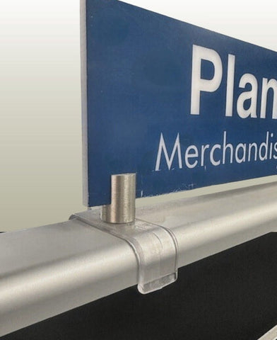 Close-up of Plankwall End Panel Sign Holder in satin chrome finish, screw-fixed to a gondola end panel for holding 8 mm retail signage cleanly and securely.