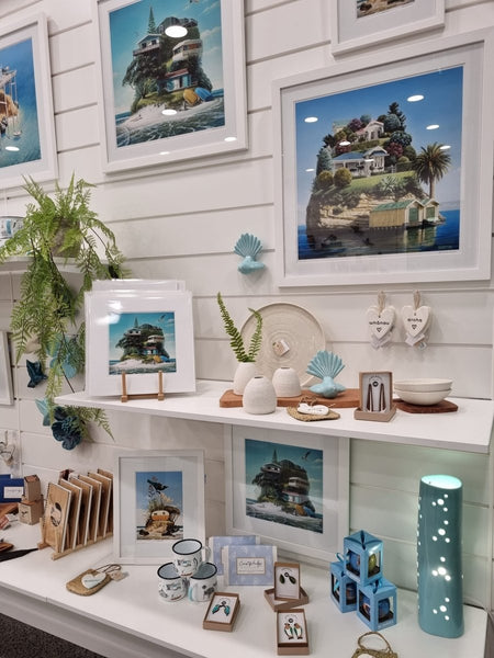 Gift shop features 18mm white melamine retail shelving as a display wall