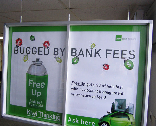 Two promotional posters for a product called 'Free Up' that claims to get rid of bank fees.