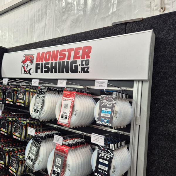 Radius header sign used on Monster Fishing Co slatwall display panel with fishing line packages in a store.