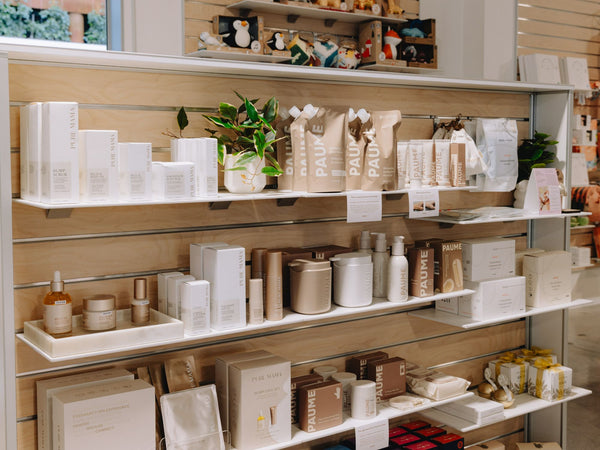 9mm thick white shelves with various products in a store setting