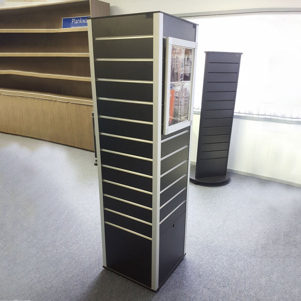 Plankwall's black slatwall rotating box display stand with hidden storage at the  showroom