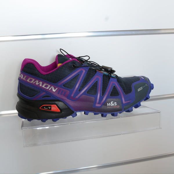 Plankwall clear acrylic shoe display shelf with purple running shoe close up on white slatwall