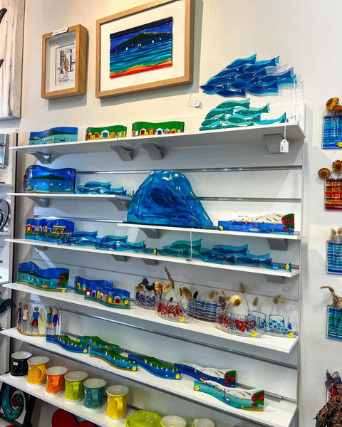 shop view of white melamine 9mm shelving mounted on white slatwall