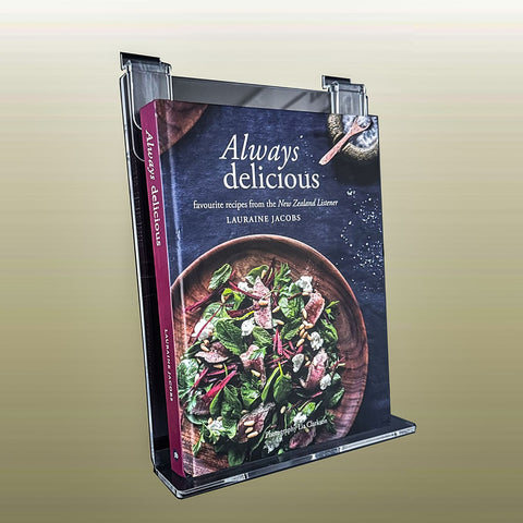 sloping wall mounted book display on slatwall