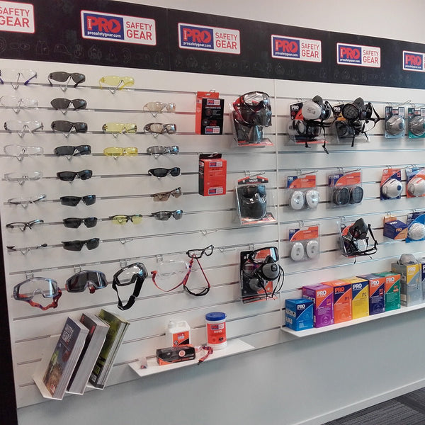 75mm pitch slatwall retail display wall features safety gear including glasses and masks with 'Pro Safety Gear' branding.