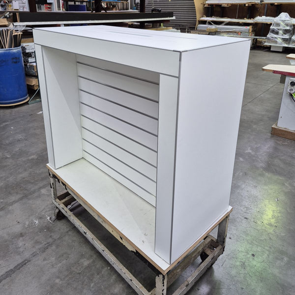 white customised slatwall electronic table with stickman m3 corners and aluminium edging 