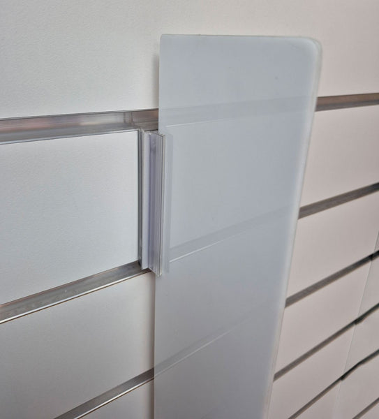 close up of slatwall wall fin clip and  vertical divider on a beige slatwall display panel