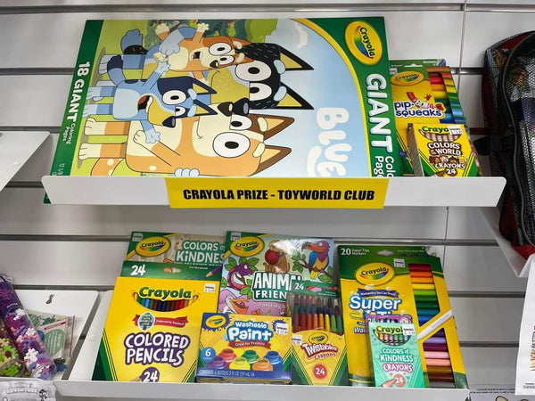 toys in retail store displayed on white 25 degree sloping shelves attached to slatwall 