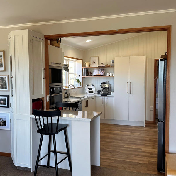 W Grooved MDF panels used to line kitchen painted white shown in a modern kitchen