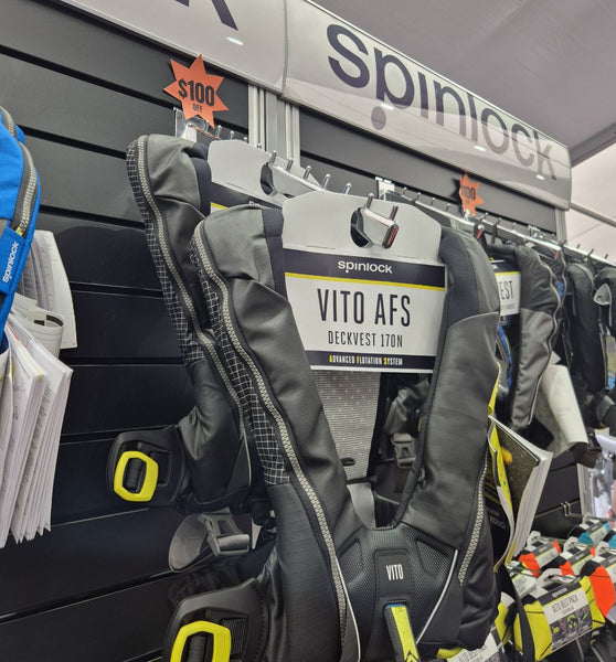 12 pin waterfall display bracket on black slatwall panel display with Radius header sign 