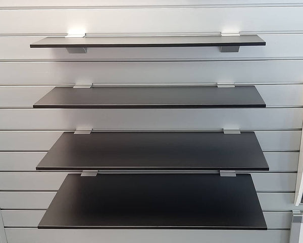 9mm melamine black shelf in front view with pvc edge tape and asb brackets mounted on slatwall
