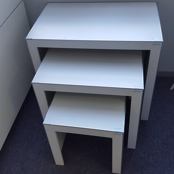 close up of 3x Plankwall nesting display tables in office. no decorations.
