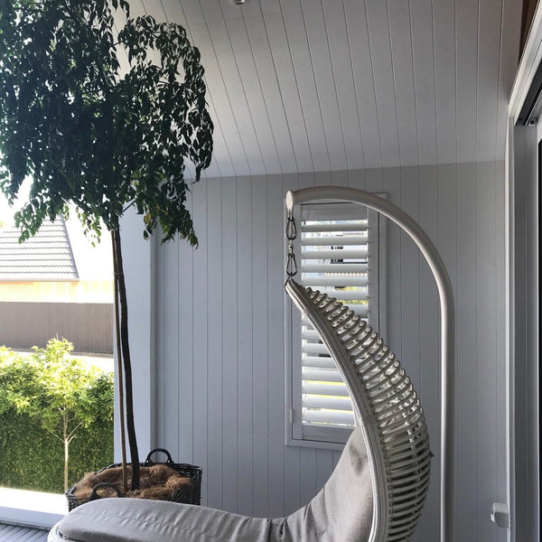 Plankwall 100mm V Groove MDF wall panels used in a sunny white modern architectural designed porch alcove