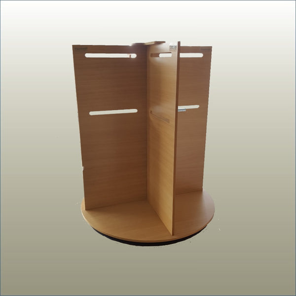 A Plankwall wooden mini rotating display stand with a turntable base, featuring slots for hooking in display prongs and a room on top for a sign holder.