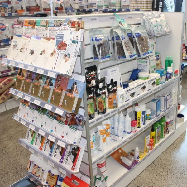 Plankwall Double Plinth G60 Gondola in white shown stocked in a veterinarian store